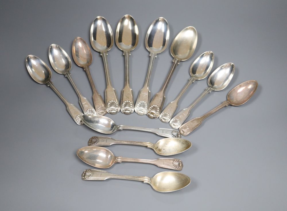 Four Victorian silver fiddle, thread and shell pattern table spoons & 4 dessert spoons.